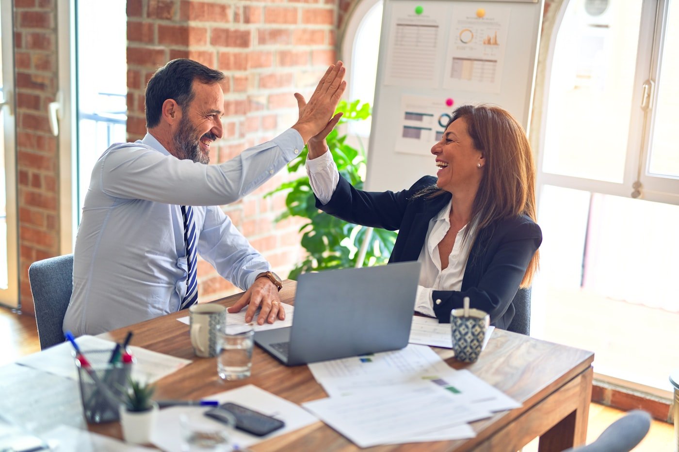 HIGHTECH consultants working with a client